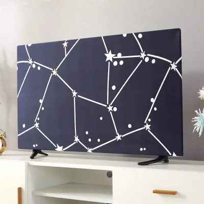 A TV cover with a constellation pattern is displayed on a television set placed on a white cabinet.
