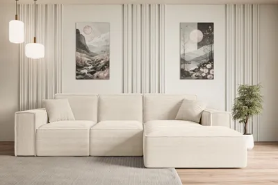 A modern living room with a sectional sofa and artwork on the wall.