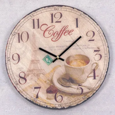 A round wooden clock with a coffee and Eiffel Tower theme.