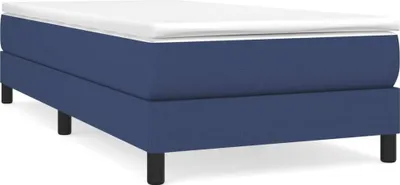 A blue boxspring bed frame with a white mattress topper, shown from a side-angle on a white background.