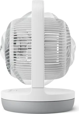 A close-up, side view of a white and gray table fan against a white background.