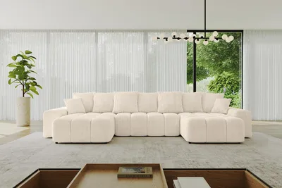 A modern living room with a large U-shaped sectional sofa in beige.