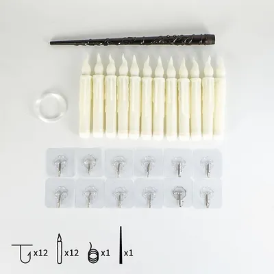 A collection of LED candles, a wand, and mounting accessories laid out on a white background.