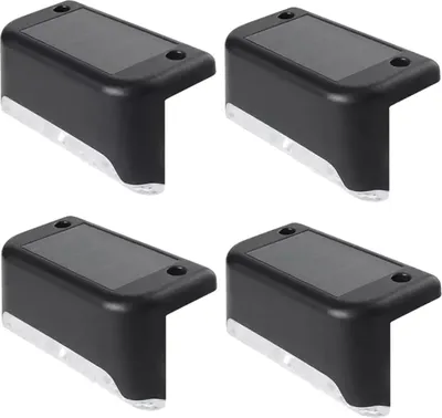 Four black solar-powered LED step lights are arranged in a 2x2 grid against a white background.