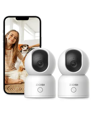 A smartphone displaying a girl and two dogs, with two ZOSI indoor security cameras in the foreground.
