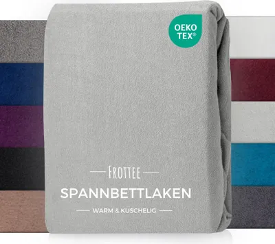 A folded grey fitted sheet with a green OEKO-TEX logo and text overlay.