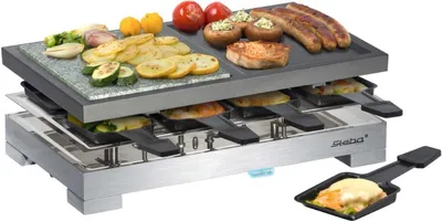 A raclette grill with food on it, shown on a white background.