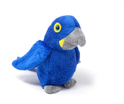 A plush toy of a hyacinth macaw is shown against a white background.