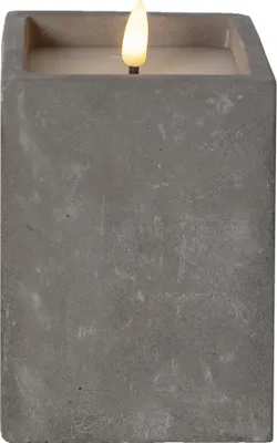 A close-up, front-facing view of a gray, concrete-like LED candle with a faux flame.