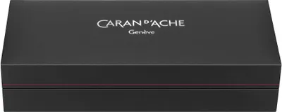 A black gift box with the CARAN D'ACHE logo and text.