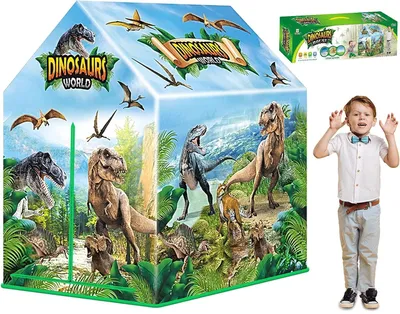 A child's play tent with a dinosaur theme, shown with a young boy standing next to it.