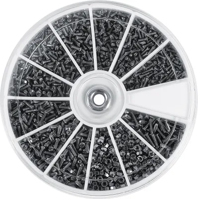 A circular container filled with small screws and nuts, divided into compartments.