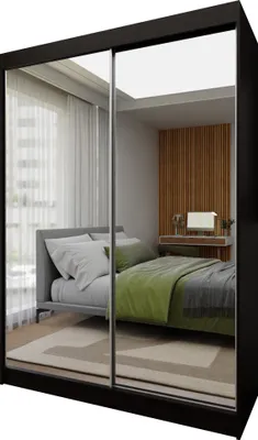 A bedroom scene reflected in the mirrored doors of a wardrobe.