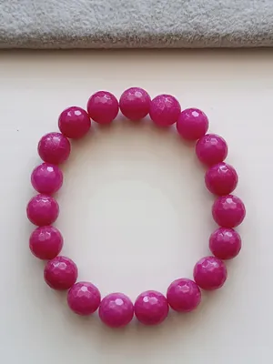 Produktbild von ROSA ARMBAND AUF EINEM ELASTISCHEN BAND MIT EINEM FACETTIERTEN JADEITSTEIN 10 mm