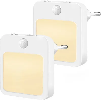 Two white LED night lights with motion and twilight sensors are shown against a white background.