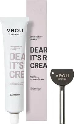 A product shot of a face cream tube, its box, and a tool, all on a white background.