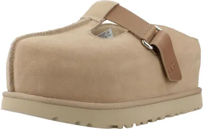 A single beige UGG clog shoe is shown from a side-angle on a white background.