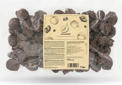 A clear, well-lit image of a bag of plums coated in dark chocolate, with a label showing product information and illustrations.