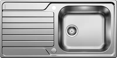 A top-down view of a stainless steel kitchen sink with a draining board.
