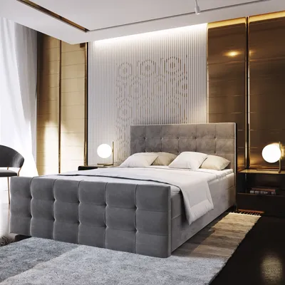 A bedroom scene featuring a large upholstered bed.