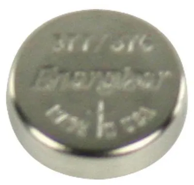 A close-up, top-down view of a silver coin-shaped battery.