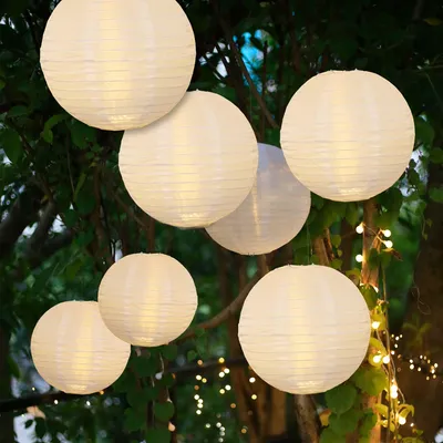 Produktbild von Lampions außen warmweiß 7Stk mit Fernbedienung 1x30 / 3x25 / 3x20cm 150889