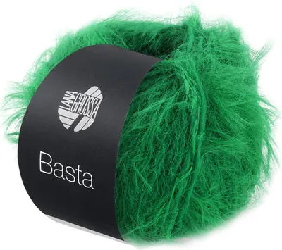 A ball of green fuzzy yarn with a black label.
