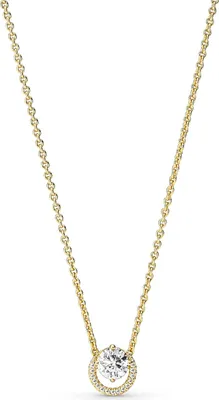 A close-up studio shot of a gold necklace with a diamond pendant.
