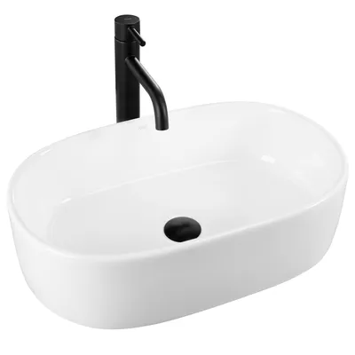 A white oval basin with a black faucet and drain.