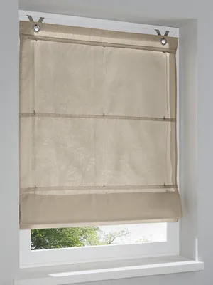 A beige Roman blind is installed on a window.
