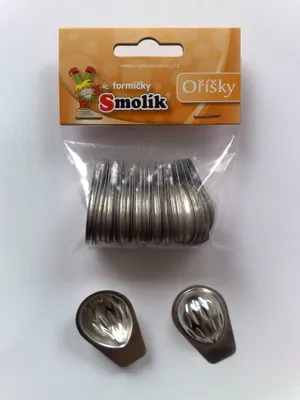 A package of small metal baking molds, possibly for cookies or candies, with two individual molds shown in the foreground.