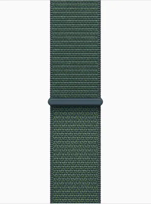 A close-up of a green fabric watch strap against a white background.