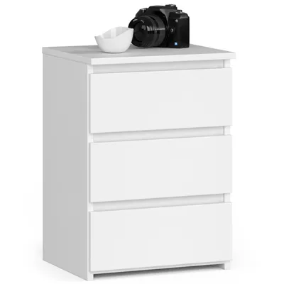 A white three-drawer nightstand with a camera and a small bowl on top.