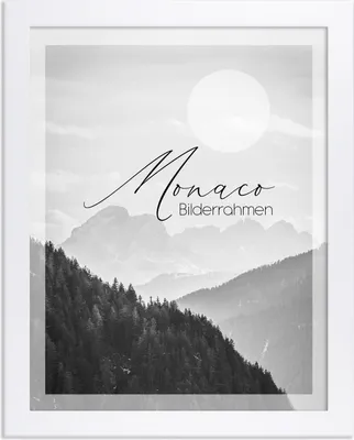 A framed picture of a mountain landscape with text overlay.