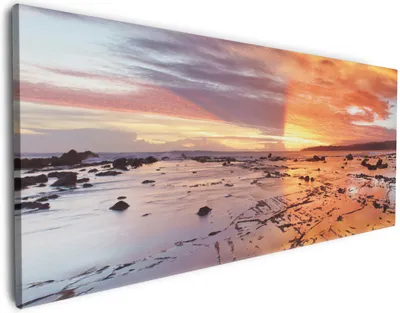 Produktbild von Wallario Premium Leinwandbild Wattwanderung am Meer bei Sonnenuntergang in Größe 50 x 125 cm