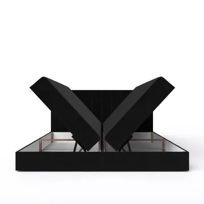 A black upholstered bed frame with its storage compartments open, revealing the internal structure and lifting mechanisms.