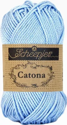 A ball of light blue yarn with a brown paper label.