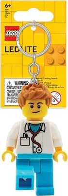 A Lego doctor figurine keychain on its packaging.