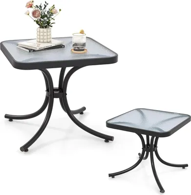Two square glass-top tables with black metal frames on a white background.