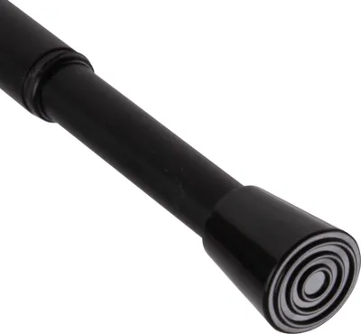 A close-up of the end of a black adjustable curtain rod.