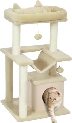 A cat tree with a cat emerging from a cubby.