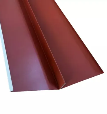 A close-up view of a red metal roof flashing, folded to show its shape.
