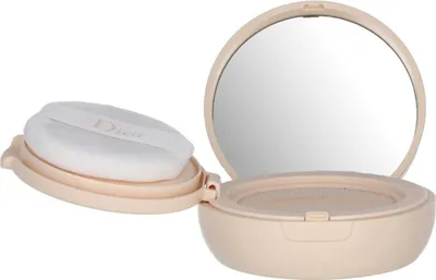 An open compact powder case with a mirror and puff.