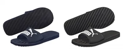 Two pairs of Puma slides, one navy and one black, shown from a top-down perspective with the soles also visible.