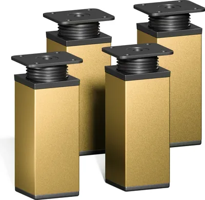 Four modern furniture legs with a gold finish and black adjustable tops are shown against a white background.