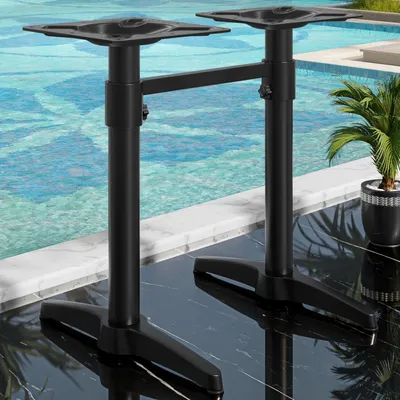 Two black bistro table bases are shown next to a swimming pool.