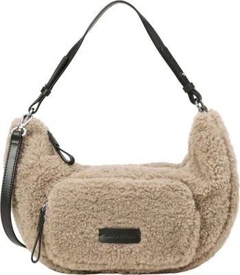 A fluffy taupe crossbody bag with black leather accents and strap, shown against a white background.