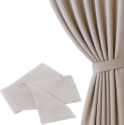 A beige curtain tie-back is shown against a white background, with a portion of a beige curtain visible on the right.