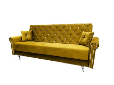 A gold tufted sofa with two throw pillows, presented on a white background.