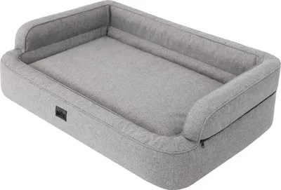 A gray dog bed with high sides is shown from a slightly elevated angle against a white background.